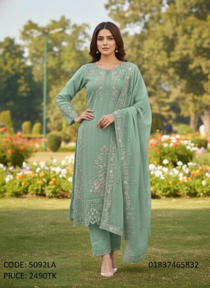 Model posing in an elegant mint green embroidered three-piece salwar kameez dress with matching dupatta and trousers (Code 5092LA).