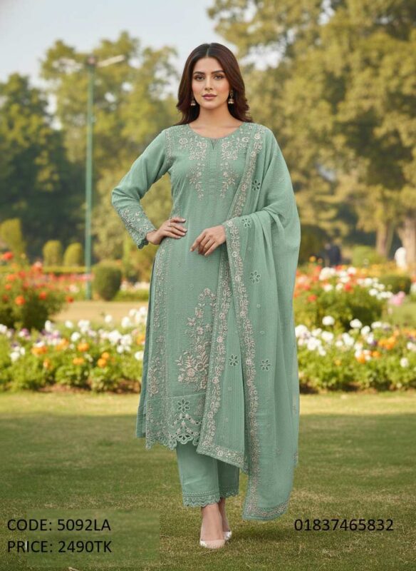 Model posing in an elegant mint green embroidered three-piece salwar kameez dress with matching dupatta and trousers (Code 5092LA).