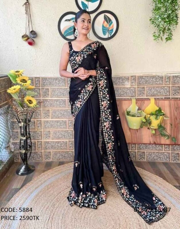 Elegantly draped black georgette saree featuring an intricate colorful floral embroidery border and matching sleeveless blouse