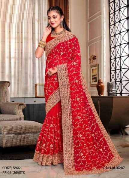 Red soft georgette saree featuring intricate golden embroidery and sequence work all over, paired with an unstitched blouse piece.