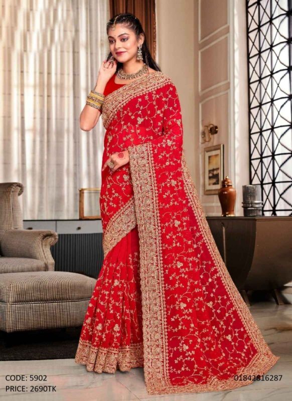 Red soft georgette saree featuring intricate golden embroidery and sequence work all over, paired with an unstitched blouse piece.